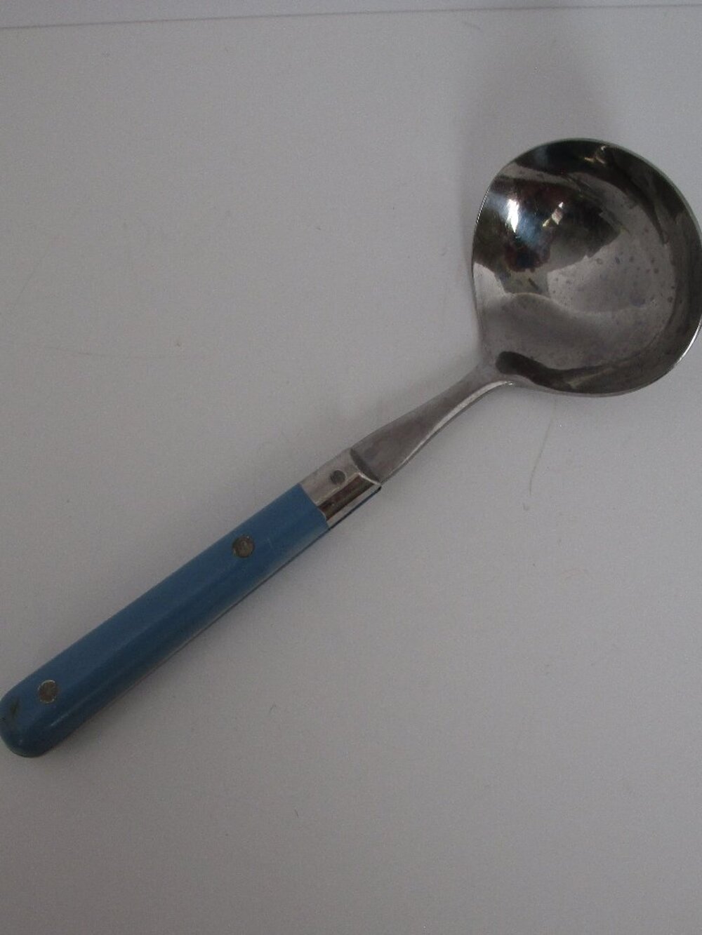 small vintage stainless steel ladle